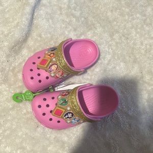 Pink and gold light up disney princess crocs for kids.